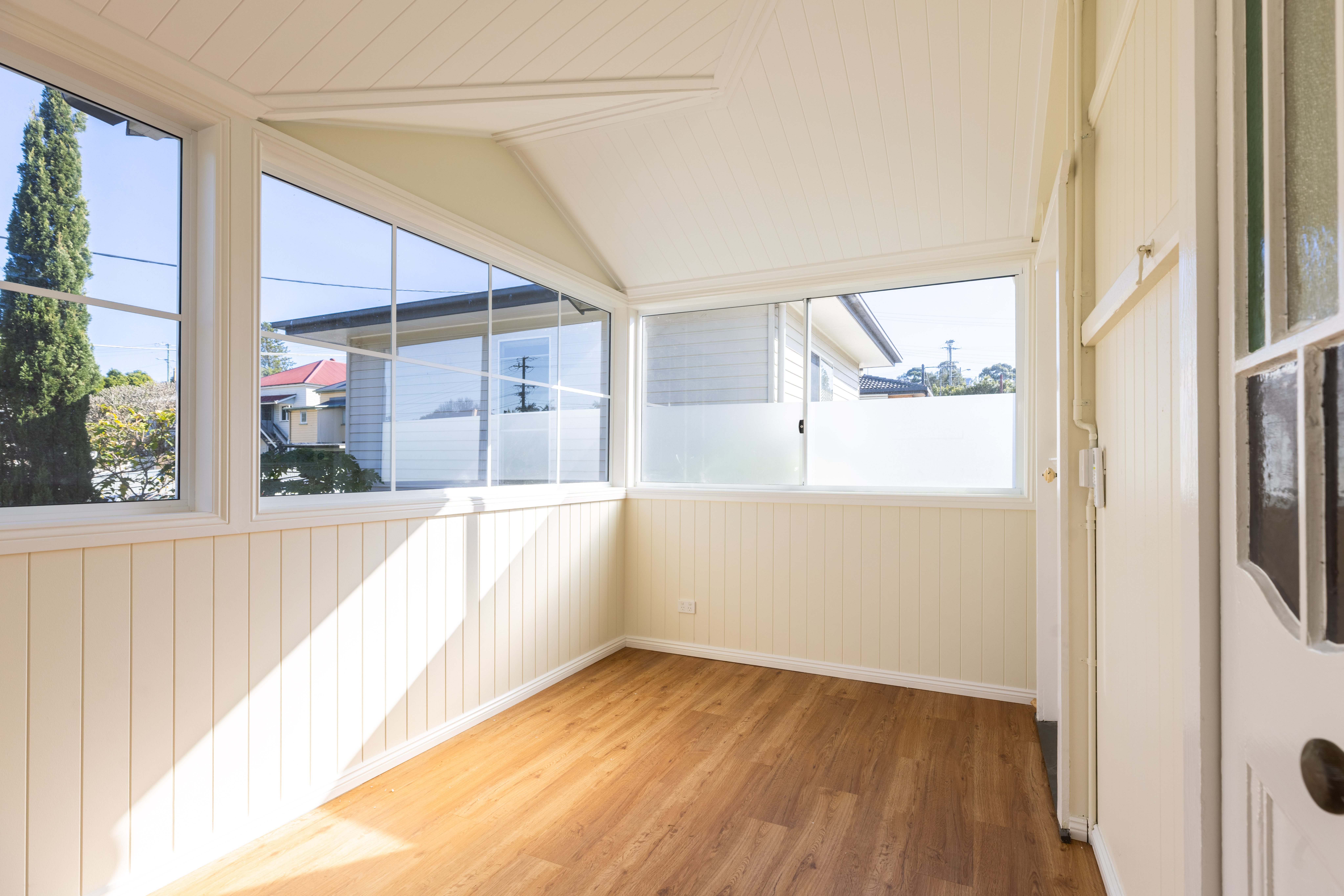 Full room view of enclosed verandah extension with all windows, South Brisbane