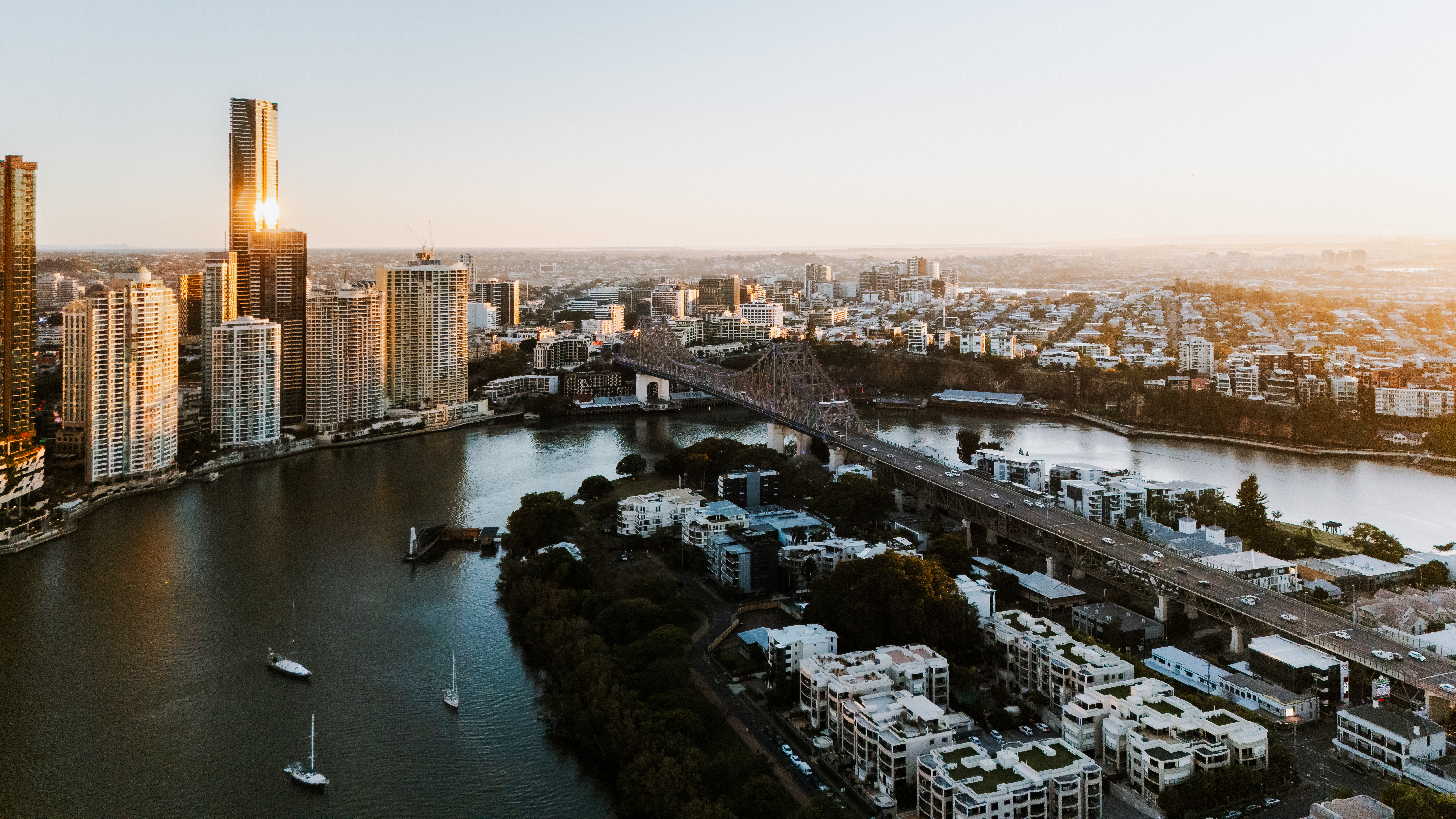 Aerial view of South Brisbane showing Story Bridge and Brisbane River at golden hour