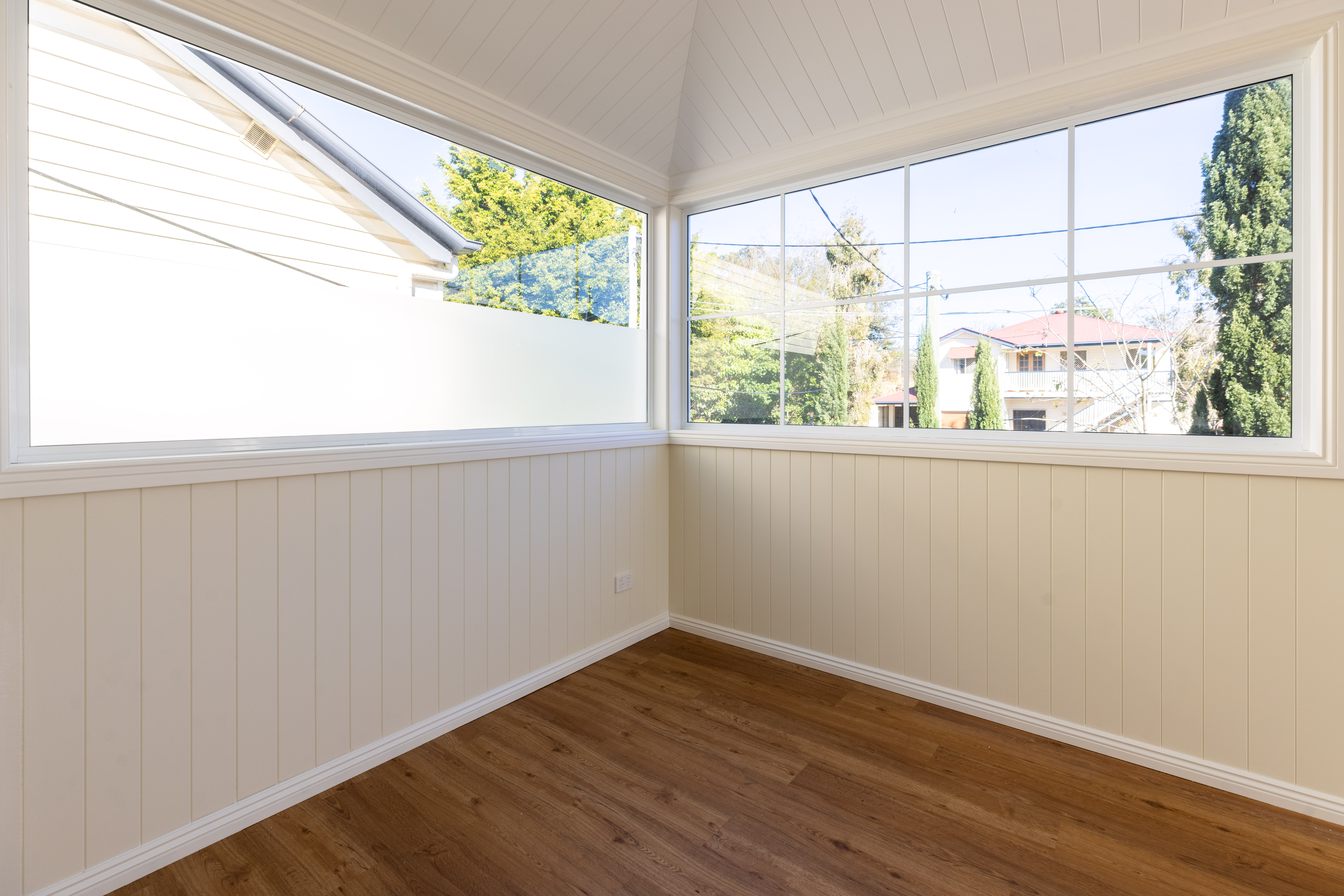 Corner window detail in completed sunroom extension, South Brisbane